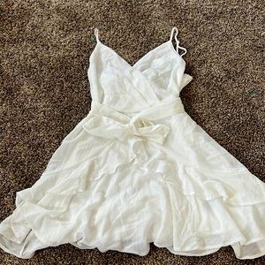 A spaghetti strap White short dress with Ribbon